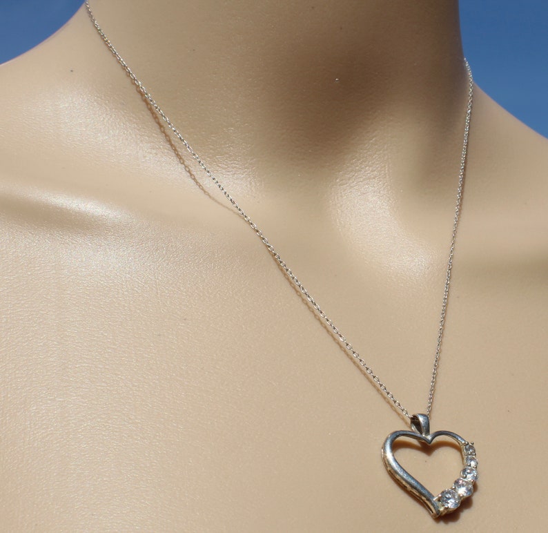 diamond look 10349 on sterling silver heart round brilliant stones five diminishing size suspended on 18 inch chain Cubic Zirconia