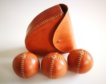 Set of three handmade juggling balls in natural leather with belt case, 45 to 75mm, stitched with baseball stitch. Perfect gift for jugglers