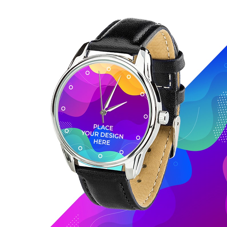 May include: A silver wristwatch with a black leather band. The watch face has a colorful abstract design and the text "PLACE YOUR DESIGN HERE".