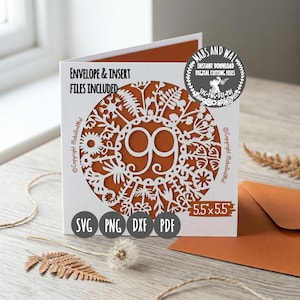 May include: A white card with a cut-out floral design and the number 99 in the center. The card is 5.5 x 5.5 inches and includes SVG, PNG, DXF, and PDF files. The text "Envelope & Insert Files Included" is visible.