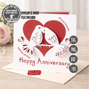 May include: A white and red anniversary card with a heart and two doves kissing. The card reads "Happy Anniversary" and includes the text "Envelope & Insert Files Included". The card measures 5.5" x 5.5".