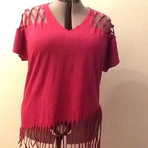 Maroon diagonal tasseled bottom cut up shirt with silver studs on diamond cut top