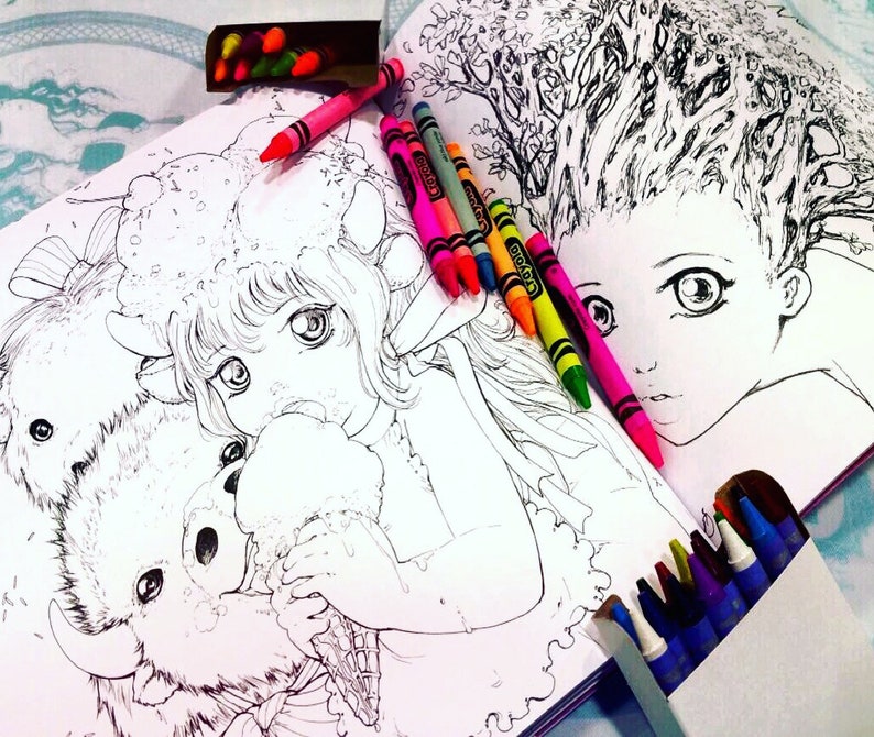 May include: A coloring book open to two pages with illustrations of a girl with a furry animal and a girl with a tree for hair. The pages are surrounded by colorful crayons.