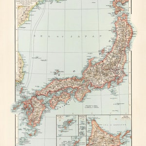 May include: A vintage map of Japan, depicting the islands of Honshu, Hokkaido, Kyushu, and Shikoku. The map is printed in shades of blue, green, and brown, with red lines indicating major roads and railways. The map also includes a key with names of cities and towns, as well as a scale bar.