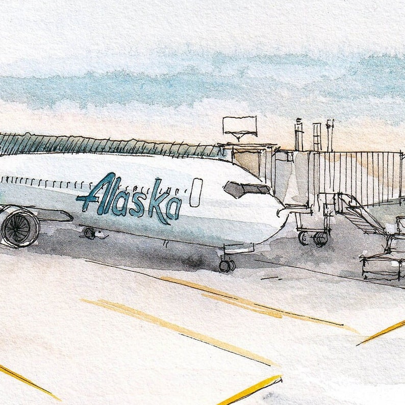 May include: A white aeroplane with the word "Alaska" in blue lettering is parked at a gate. The aeroplane is connected to a jet bridge.