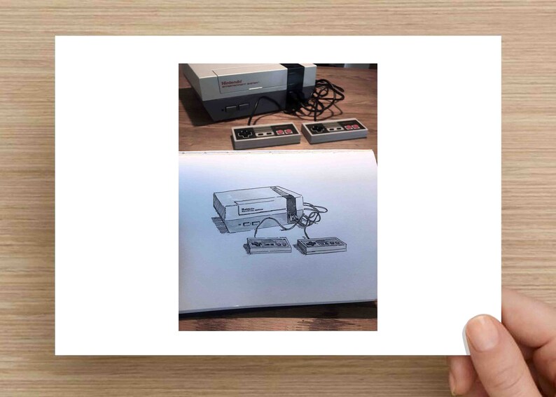 May include: An image featuring a classic Nintendo Entertainment System (NES) console with two controllers. The image also includes a sketch of the same console and controllers. The console is gray and black, with the controllers featuring red and gray buttons.
