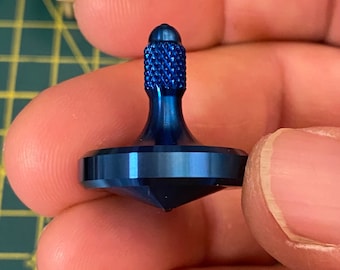 Solid steel spinning top