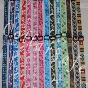 May include: A selection of colorful dog collars with various patterns, including anchors, Hawaiian flowers, paw prints, bones, camouflage, and argyle. The collars are made of nylon and have a plastic buckle.