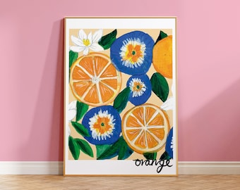 May include: A framed print with a colorful illustration of orange slices and blue flowers. The background is a light beige color and the text "orange" is written at the bottom of the print.