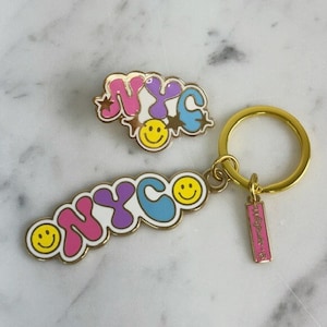NYC Smiley Enamel Pin / Keychain - Enamel Pins / Keychains - New York City Souvenir - NYC Travel Gifts - Hat Pin - Wildflower + Co. Gifts