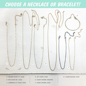 May include: A selection of gold and silver necklaces and a gold bangle bracelet. The necklaces are different lengths and styles, including beaded, box, and superfine chains. The bangle bracelet is a simple, classic design.