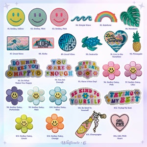 May include: Collection of embroidered patches with various designs, including smiley faces, waves, rainbows, and floral motifs. The patches feature text like "Aloha," "Good Vibes," and "Be Kind to Yourself."