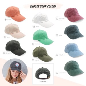 May include: A selection of ten different coloured baseball caps. The caps are arranged in two rows of five. The colours are coral, blush, charcoal, white, mermaid, burgundy, navy, cactus, baby blue, and forest green. The text "CHOOSE YOUR COLOR!" is displayed above the caps. The text "BACK VIEW" is displayed below the caps.