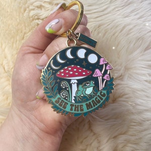 See the Magic Nature Keychain - Cottagecore Enamel Key Chain / Bag Charm -  Frog, Mushroom, Moon Phases & Plants! Glow in the Dark