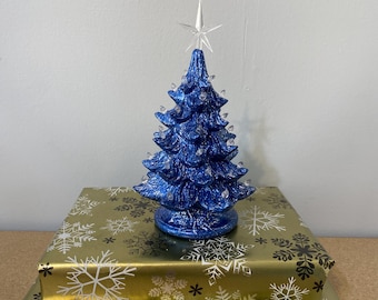 8.5 inch Metallic Blue Ceramic Christmas Tree with clear bulbs: Battery Operated, Multi-Color Lights