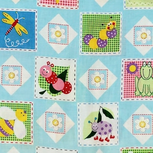 May include: A blue fabric with a repeating pattern of colorful insects and flowers. The insects include a yellow and purple bee, a pink and red ladybug, a green frog, a yellow and purple caterpillar, and a yellow dragonfly. The flowers are white with yellow centers.