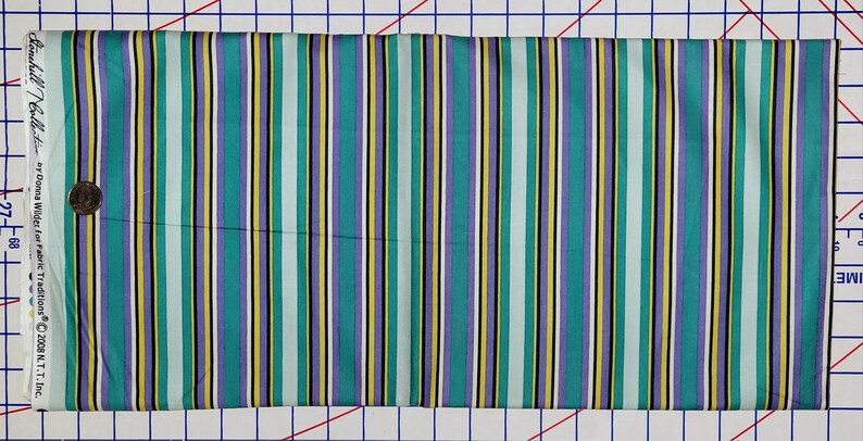 May include: Striped fabric in shades of teal, purple, yellow, white, and black. The fabric is 44 inches wide and is part of the "Donna Wilder for Fabric Traditions" collection.