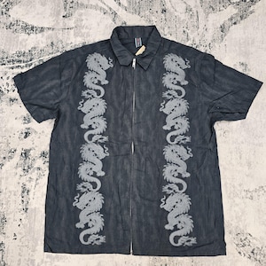 May include: A short-sleeved, charcoal gray button-down shirt featuring a full-length front zipper closure and a classic collar. The shirt is decorated with two vertical panels of light gray embroidered dragon motifs running down the front.