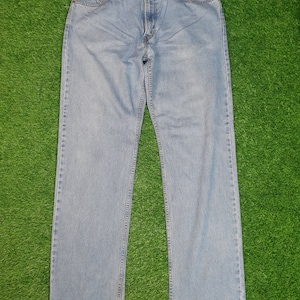 Vintage LEVIS 505 Light Wash Sun Faded Levis 505 Relaxed Fit Light Blue Levis Ripped Distressed  Size 38X35.5 Jeans L0166