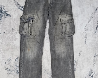 May include: Gray cargo pants with multiple pockets and a faded look.
