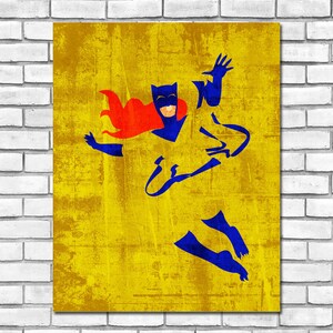 May include: A blue and red silhouette of a superhero in a flying pose against a yellow distressed background.
