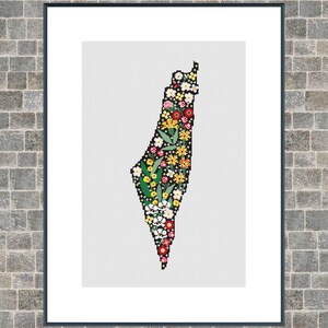 May include: A framed print featuring a floral design in the shape of a country. The artwork showcases a black outline filled with a variety of colorful flowers, including red, yellow, and white blooms. The frame is dark, and the background is a light gray.