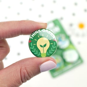 May include: Green button with a light bulb and leaves, and the text "Think Green".