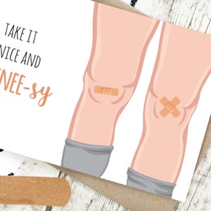 May include: A greeting card with a cartoon illustration of a pair of legs with bandages on the knees. The text on the card reads "Take it nice and knee-sy."