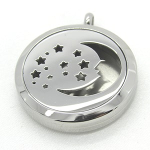 May include: Silver stainless steel aromatherapy diffuser necklace with a crescent moon and stars design.