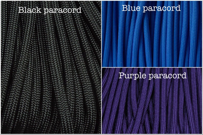 May include: Three spools of paracord in black, blue, and purple. The paracord is a type of rope used for crafting and survival.