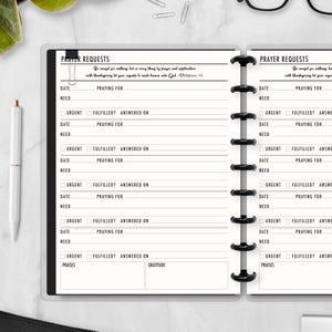 May include: A black and white prayer request journal with lined pages for recording dates, needs, and prayers. The journal includes sections for urgent requests, fulfillment status, and gratitude. The text "PRAYER REQUESTS" is at the top.