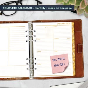 May include: Open brown leather planner with gold-colored pages. The planner is open to a January 2028 calendar view, with a pink sticky note that reads "Yes, this is real foil!". The top of the planner reads "COMPLETE CALENDAR - monthly + week on one page".
