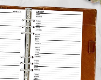 May include: A brown leather binder with a silver metal clasp, open to reveal a contact list. The contact list has the word "CONTACTS" at the top, followed by fields for name, address, phone, mobile, and email. The binder is on a white marble surface.