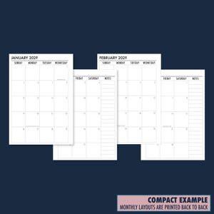 Dark navy background flat lay showing the compact insert example with monthly calendar pages printed back to back. Labeled Compact Example — monthly calendars are printed back to back. Physical planner refills only, no binder or accessories included.