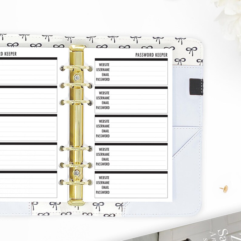 Personal size password keeper planner inserts in a ring binder with gold six-ring mechanism, organized layout with labeled fields for Website, Username, Email, and Password to log all your account credentials in one place, printed on 80lb bright white paper. Planner inserts made in the USA by CityGirl Planners. Physical inserts only no binder or accessories included.