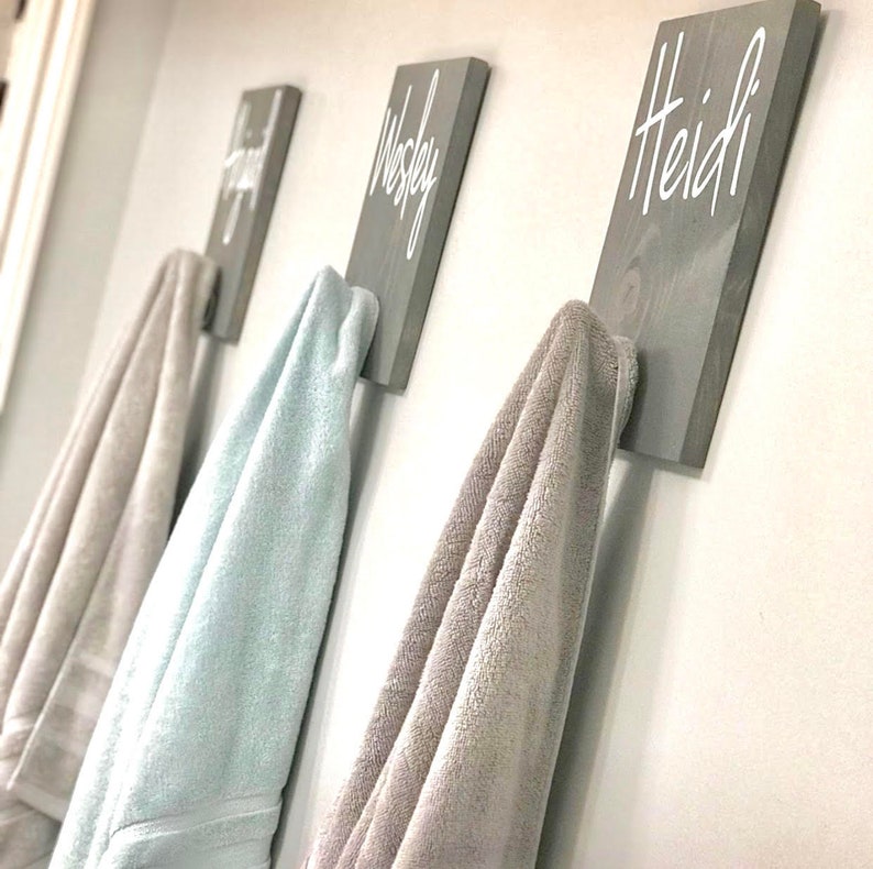 a row of towels hanging on a wall