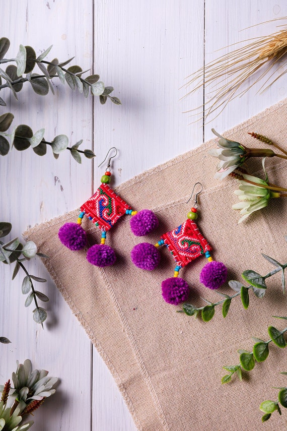 Purple pom pom earrings clearance