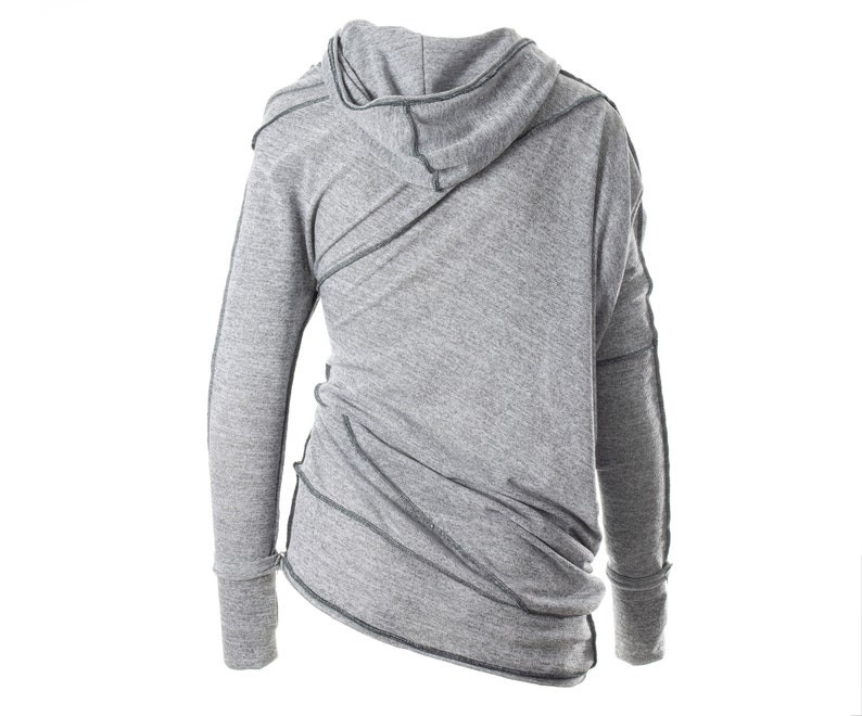 May include: Gray hooded sweatshirt with long sleeves and a diagonal seam detail. The sweatshirt has a relaxed fit and a slightly asymmetrical hem.