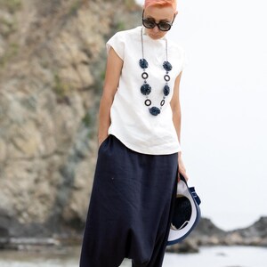 Linen blouse styled for modern summer capsule wardrobe