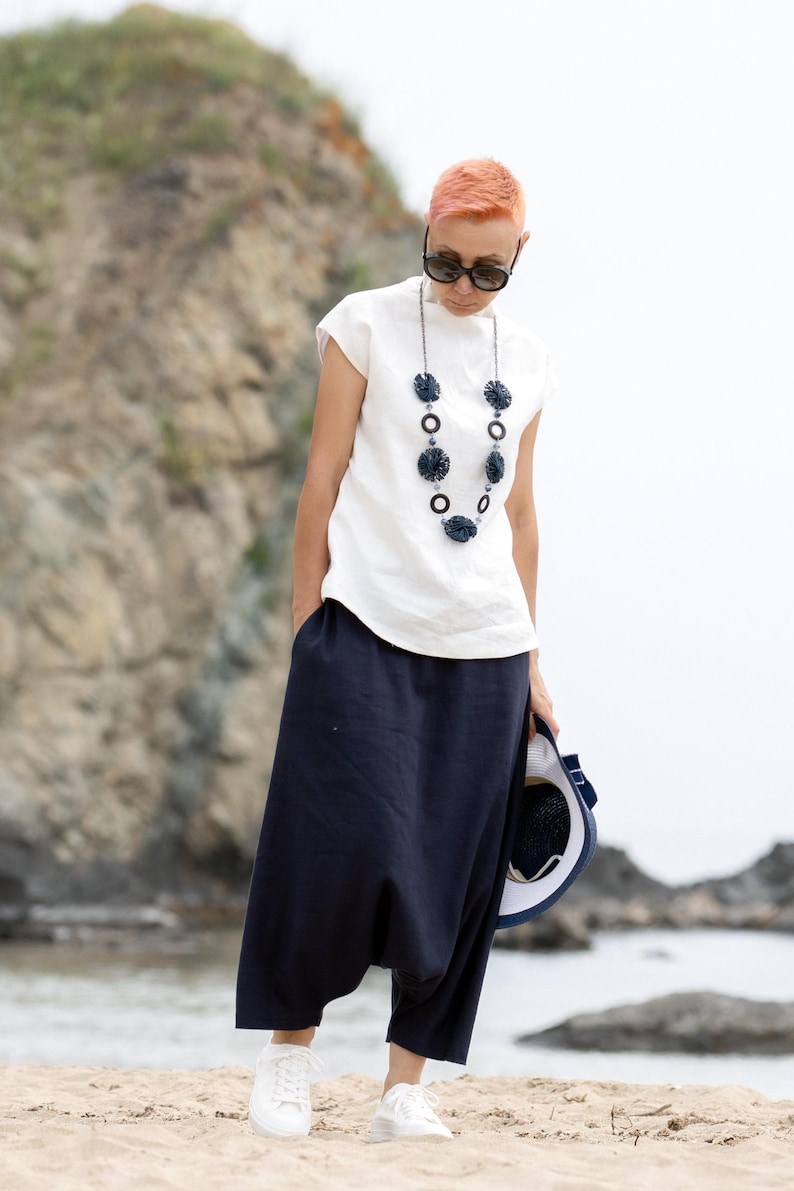 Linen blouse styled for modern summer capsule wardrobe