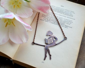 Girl reading a book, copper necklace