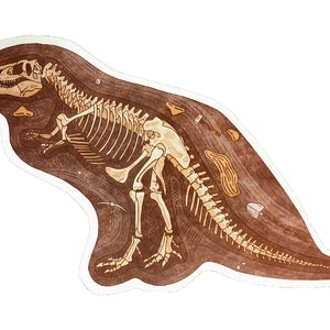 Peut inclure: Une illustration brune et beige d'un squelette de dinosaure, partiellement d&eacute;terr&eacute;, avec une pioche et d'autres outils &agrave; proximit&eacute;.
