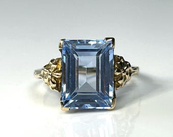 Art Deco Vergissmeinnicht Blautopas Smaragdschliff Ring in Gelbgold