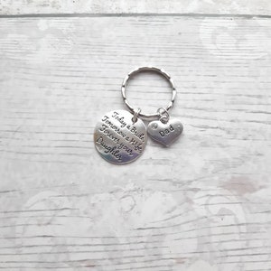 May include: Silver keychain with a round charm that reads "Today a Bride, Tomorrow a Wife, Forever your Daughter" and a heart charm that reads "Dad".