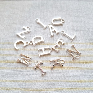 Add on silver initial charm, personalise an order, add a letter, letter charm, personalize a gift, added personalisation