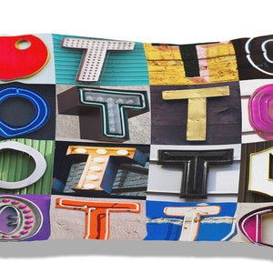 May include: A pillowcase with a colorful patchwork design featuring the letter "O" and the letter "T" repeated multiple times. The letters are in various styles and colors, including neon blue, red, gold, and white.