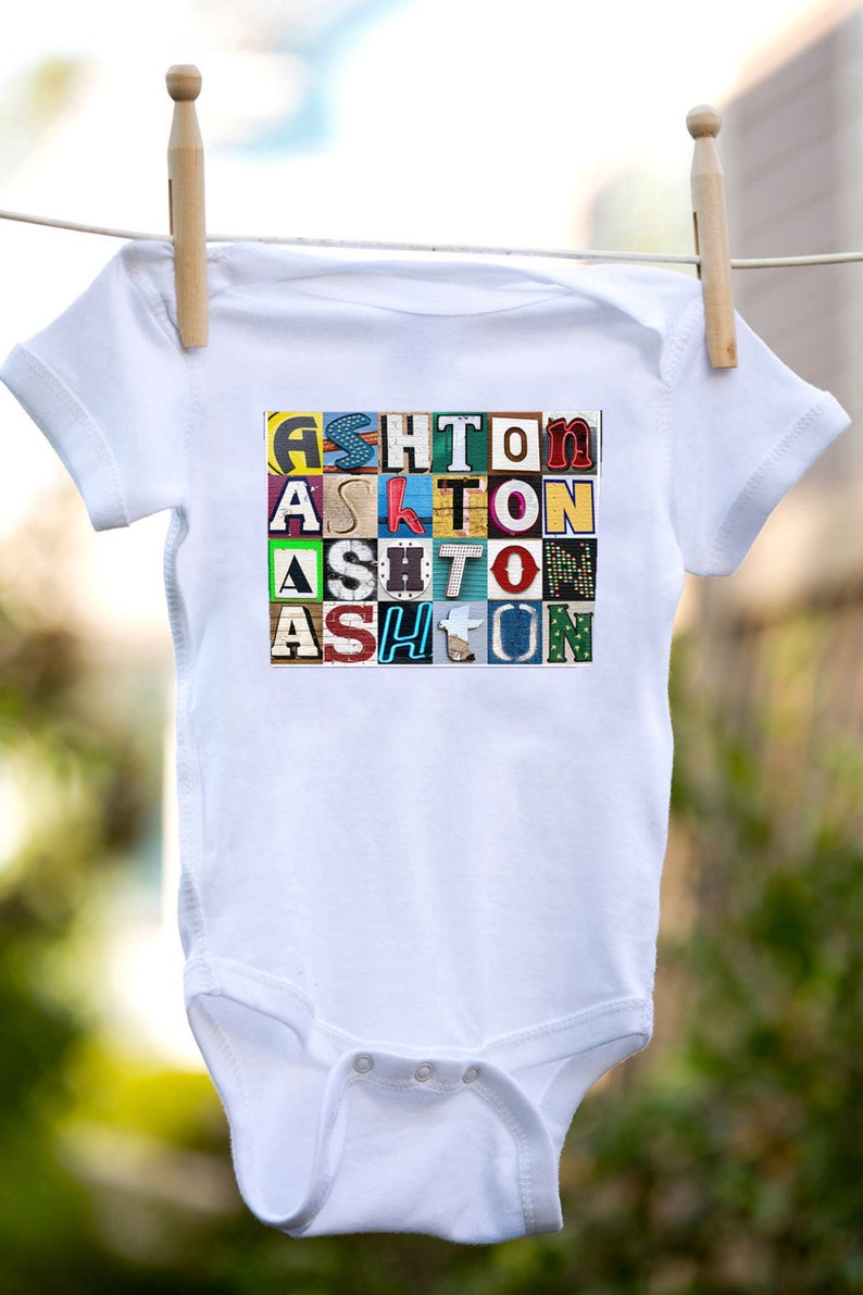 Personalized baby bodysuit featuring the name ASHTON showcased