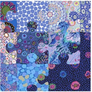May include: A colorful jigsaw puzzle with a variety of blue patterns. The puzzle pieces feature floral, polka dot, and abstract designs in shades of blue, purple, and green. The overall theme is a vibrant and artistic display.