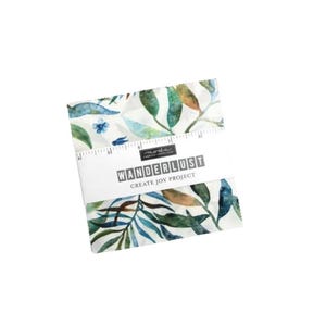 May include: A fabric bundle featuring a watercolour botanical print in green and blue hues. The fabric is wrapped with a white band that reads "WANDERLUST CREATE JOY PROJECT". A ruler is printed along the edge of the fabric.