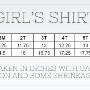 May include: A size chart for a girl's shirt, with chest width and length measurements in inches. Sizes range from 6 months to 12 years. The text states measurements are taken with the garment lying flat and that shrinkage is expected.
